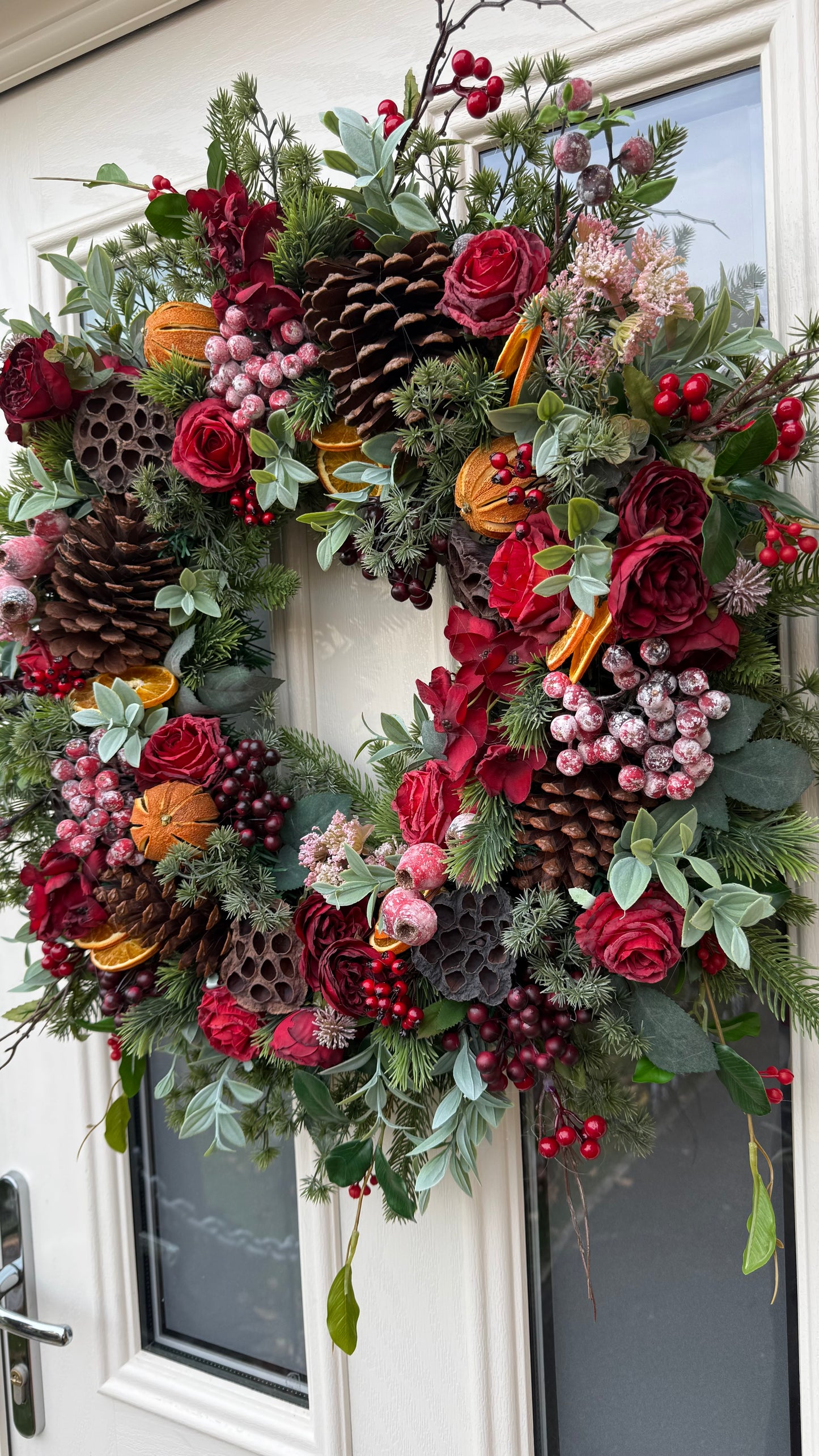 Red berry and orange winter wreath