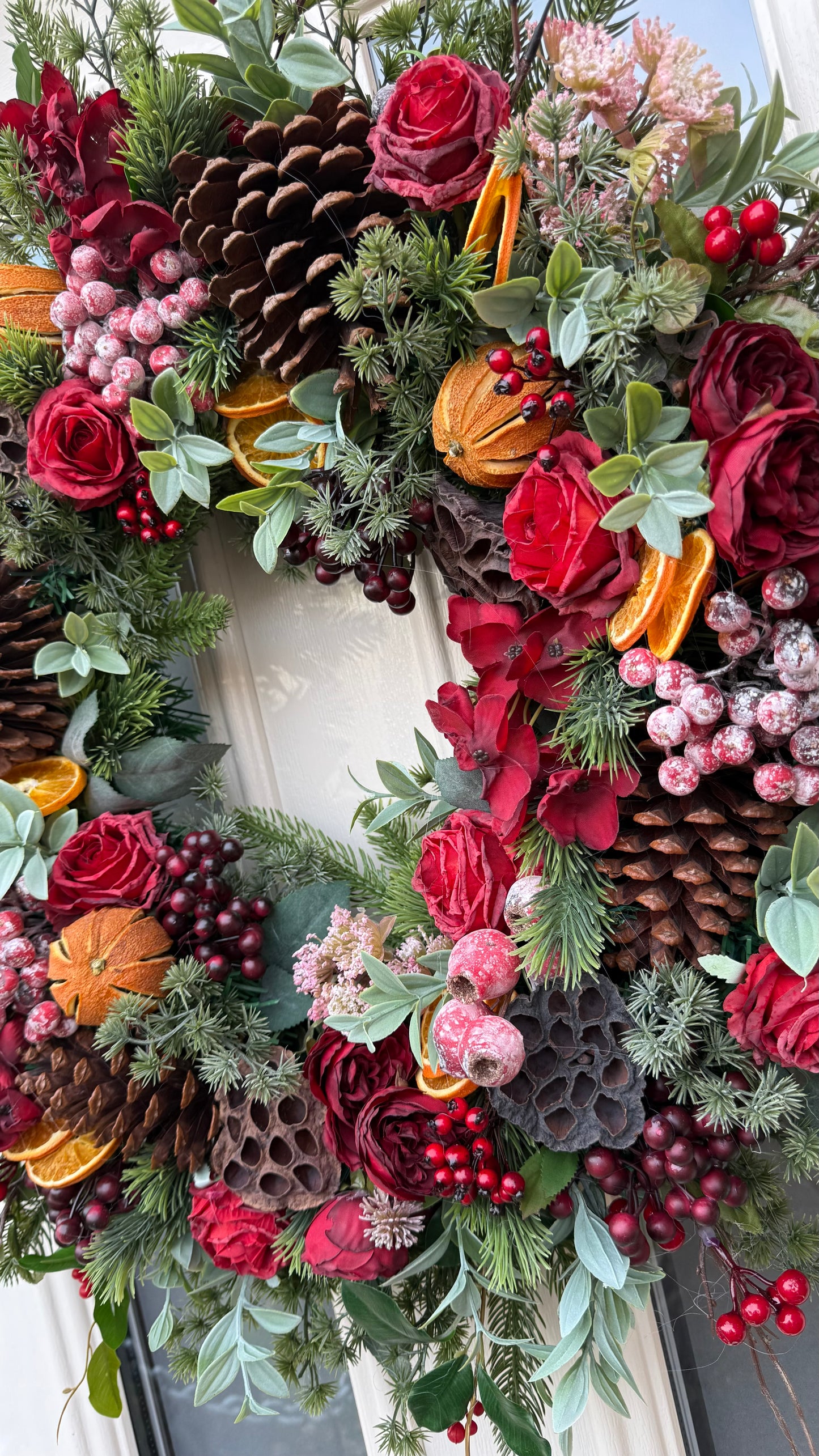 Red berry and orange winter wreath