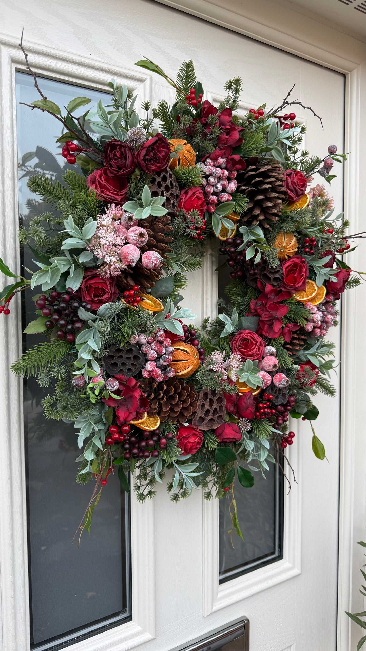 Red berry and orange winter wreath