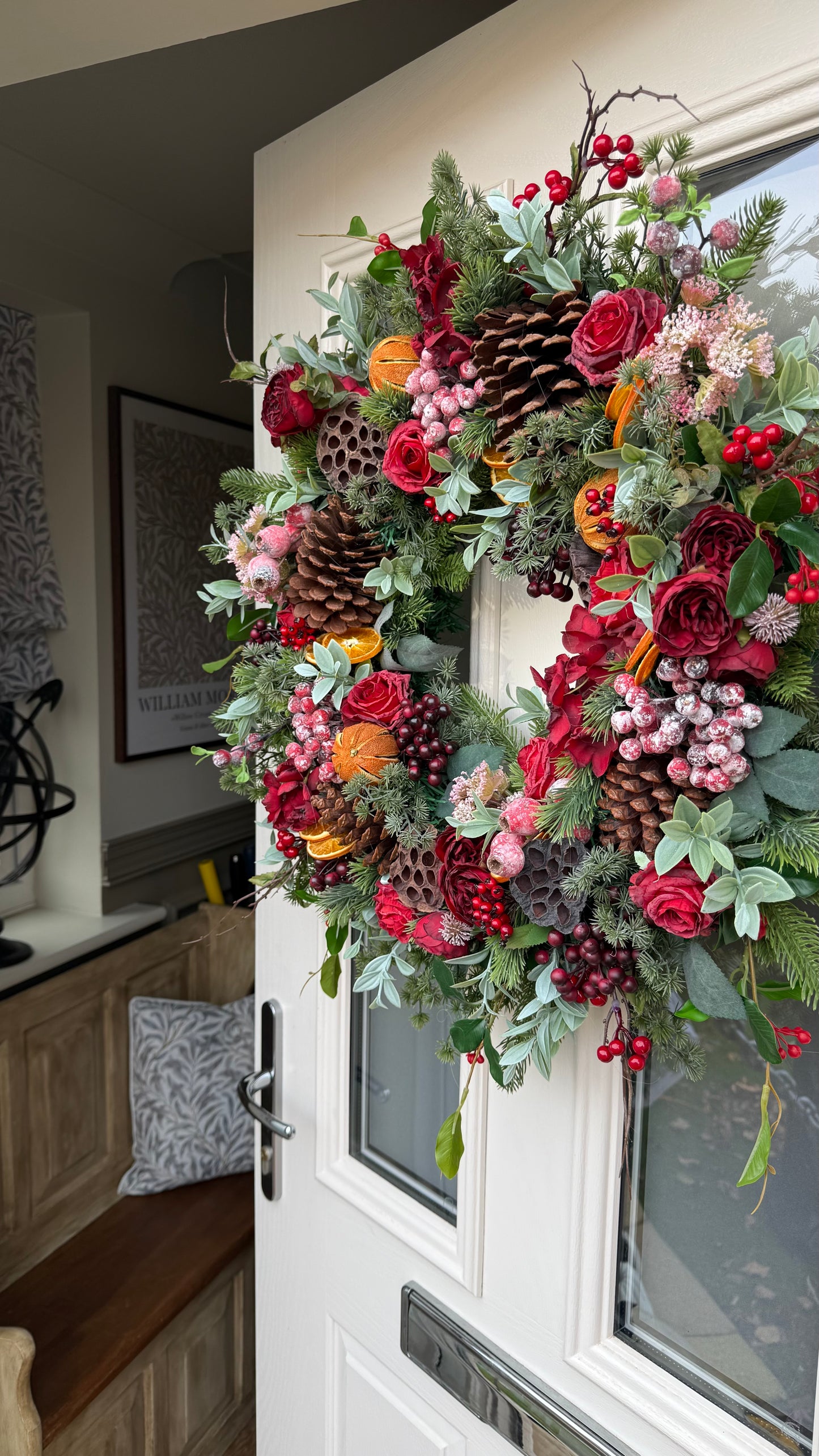 Red berry and orange winter wreath