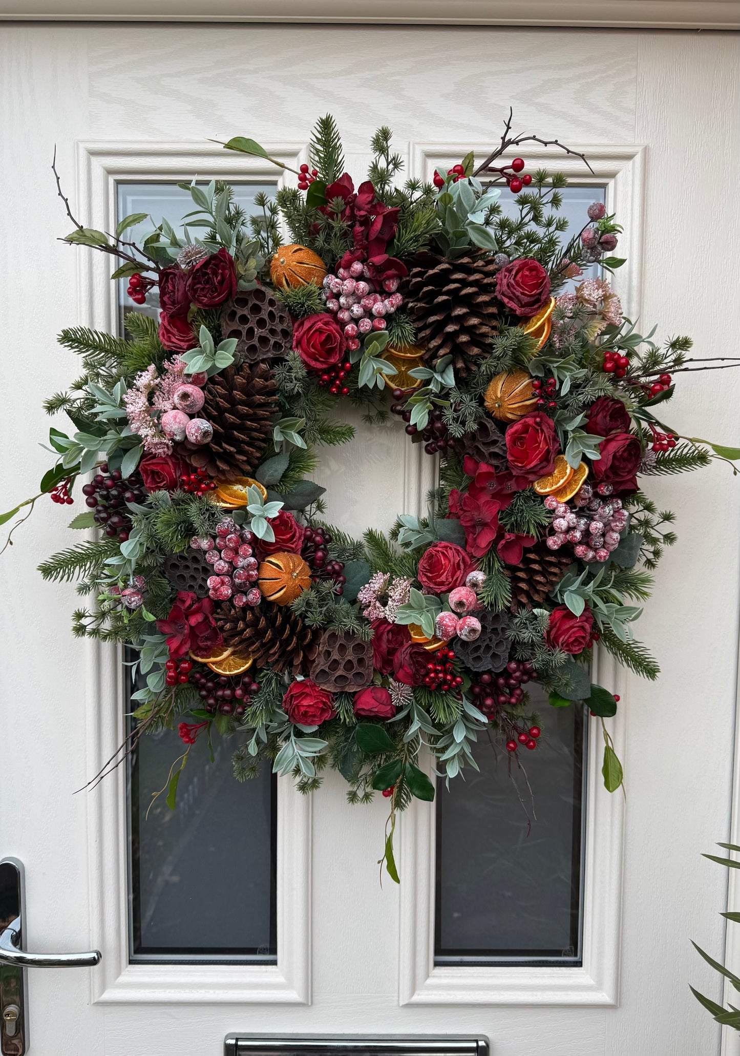 Red berry and orange winter wreath