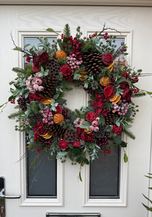 Red berry and orange winter wreath